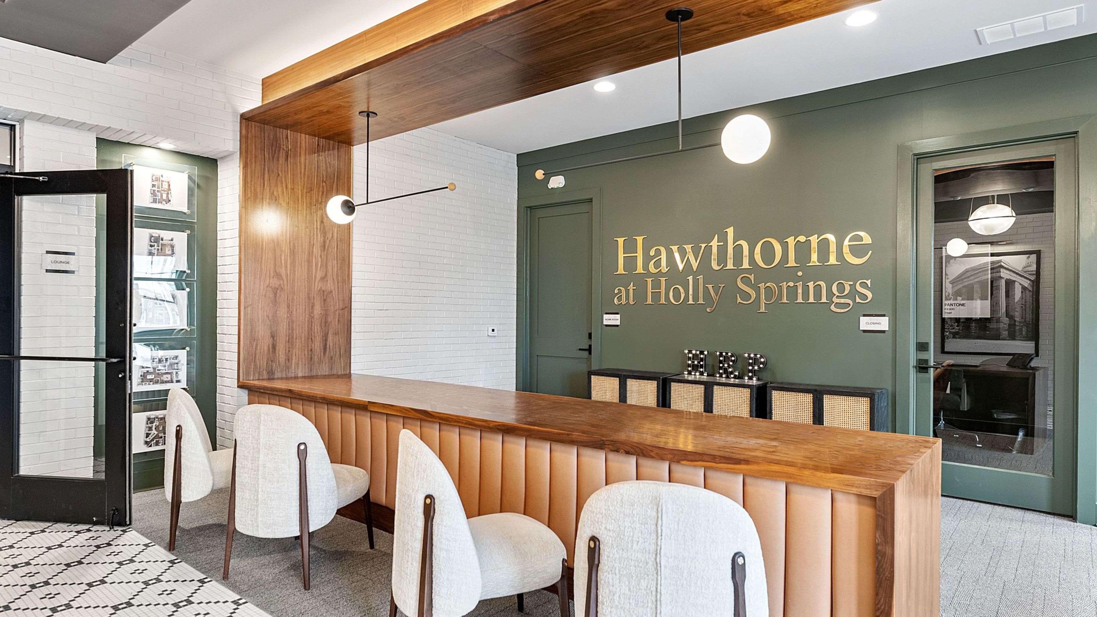 Hawthorne at Holly Springs beautiful apartment leasing office with office space and seating